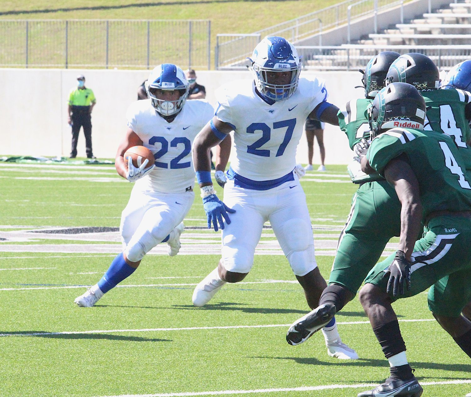 Taylor senior running back Casey Shorter eyes a path behind the blocking of Dylan Spencer during Saturday's game against Mayde Creek at Legacy Stadium.